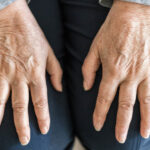 Senior woman suffering from arthritis